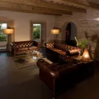 Poltrona da Salotto in Cuoio Vintage Effetto Invecchiato con Ruote e Braccioli - Timbro Viadurini
